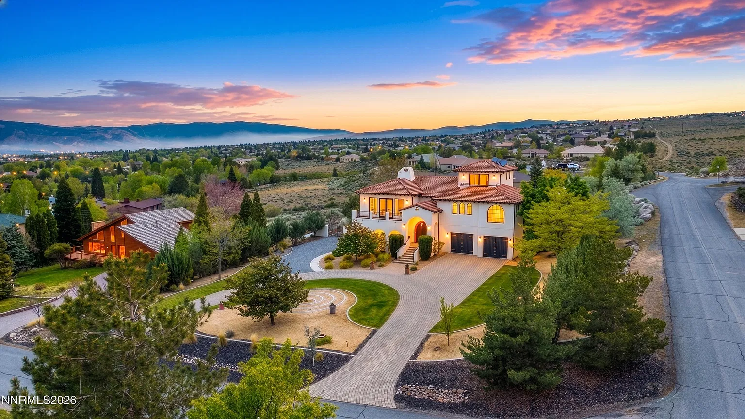 Aerial view of the house and lot at sunset