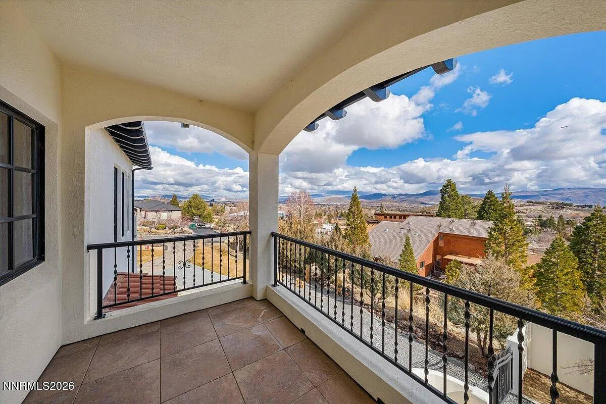 Covered arched balcony with mountain views
