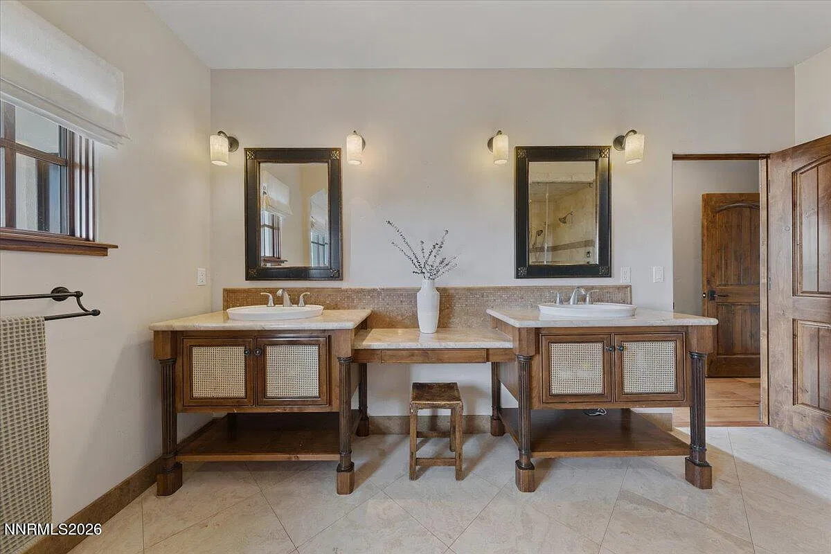 Primary bath with two furniture-style vanities